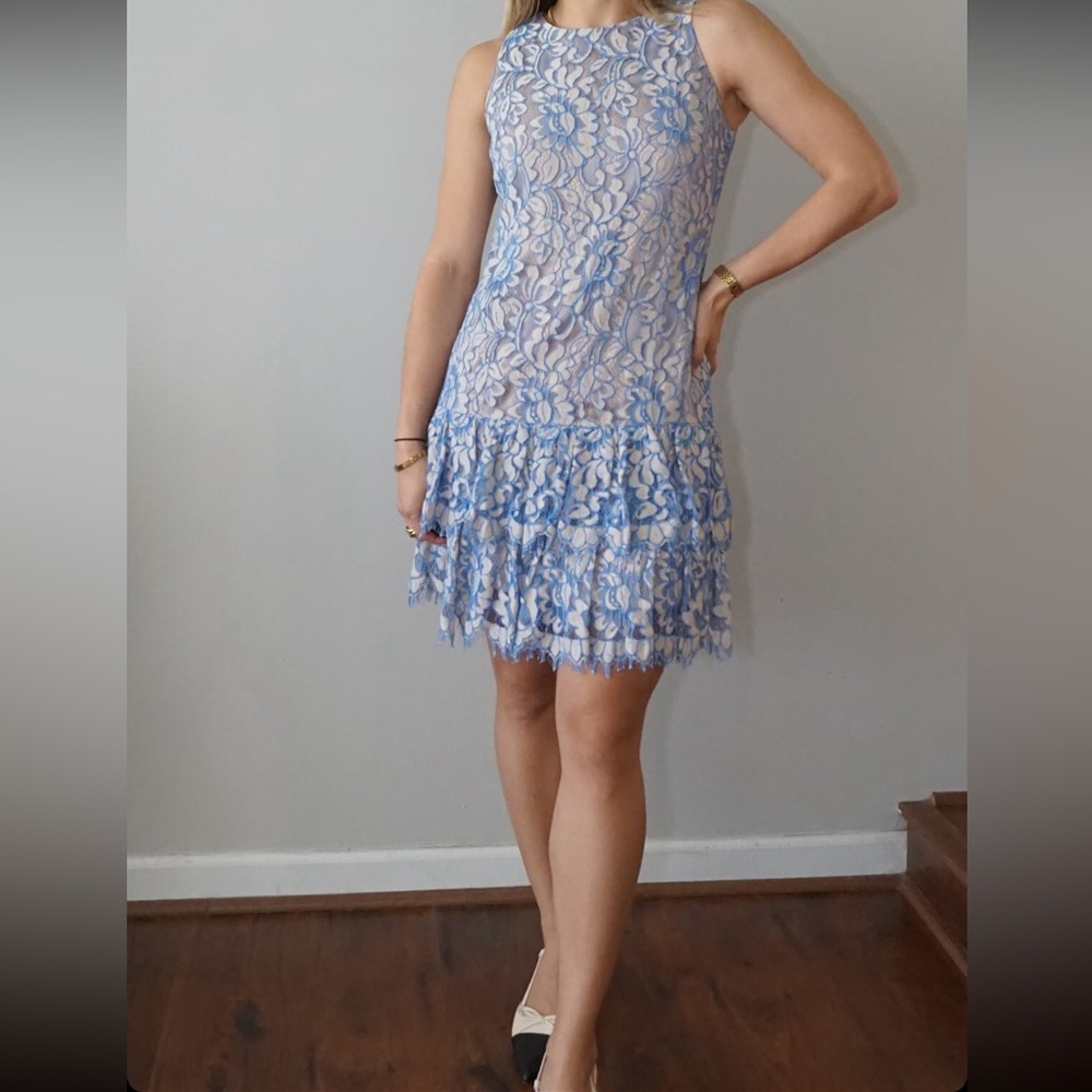 By Eliza J; blue short dress imported. - 37% cotton, 35% rayon, 28% nylon.